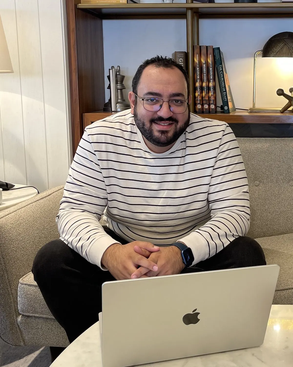Bishoy Awad, founder of RoundBorders, at his laptop