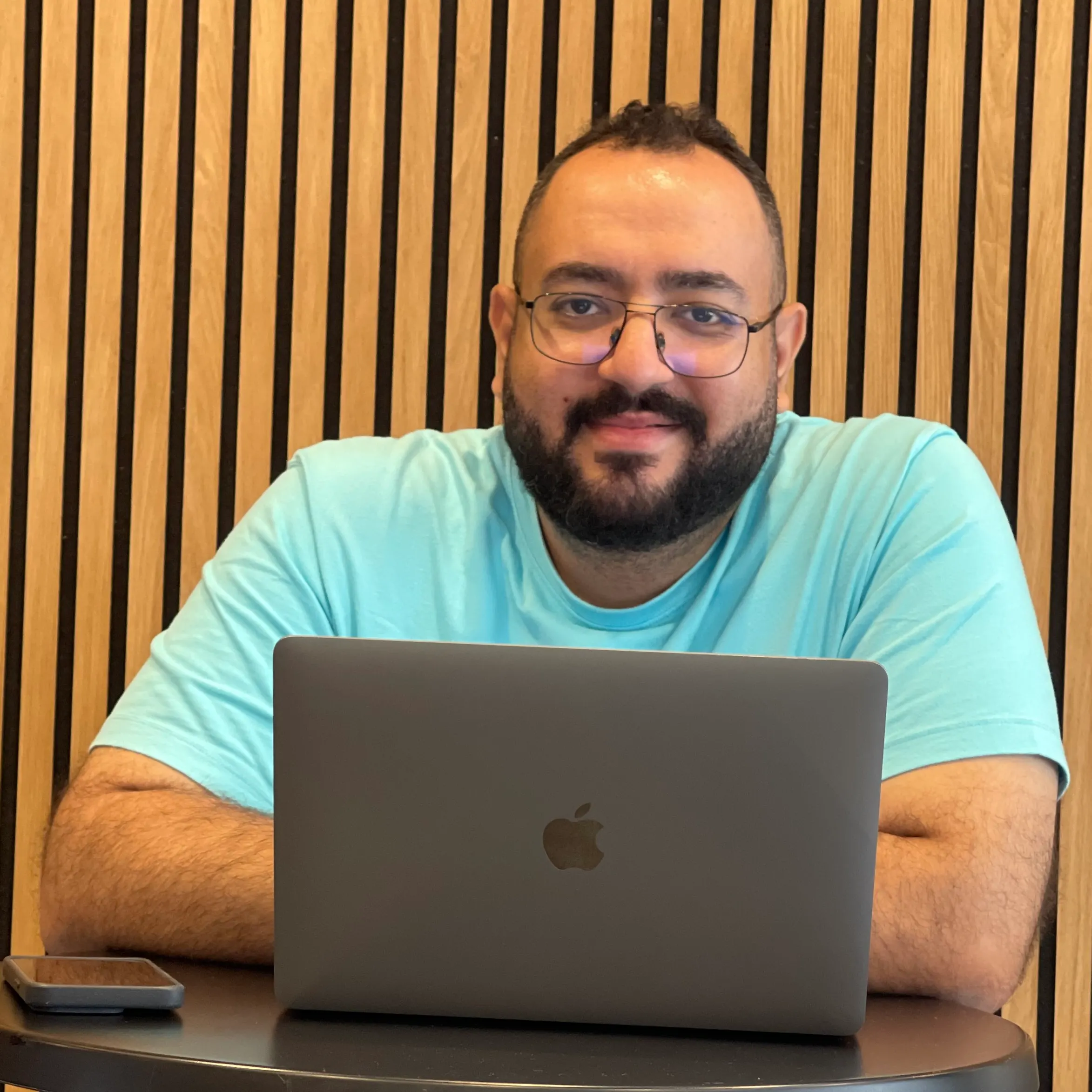 Bishoy Awad, founder of RoundBorders, at his laptop